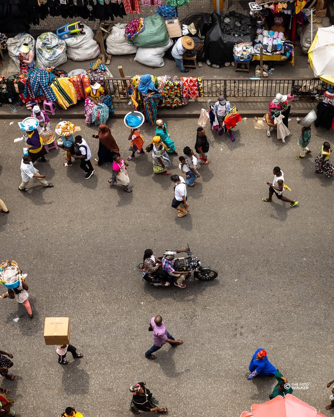 A busy Makola market street